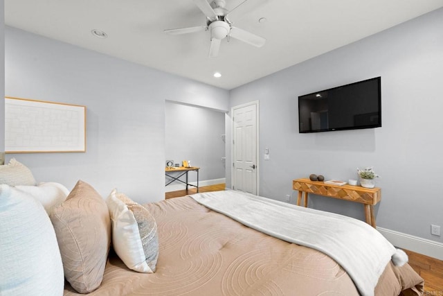 bedroom featuring wood-type flooring and ceiling fan