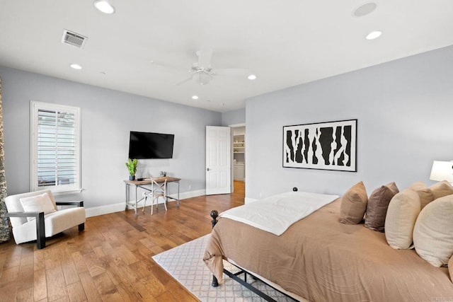 bedroom featuring hardwood / wood-style flooring and ceiling fan