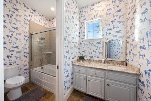 full bathroom featuring vanity, tile patterned flooring, enclosed tub / shower combo, and toilet