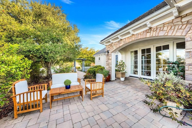 view of patio featuring outdoor lounge area and french doors