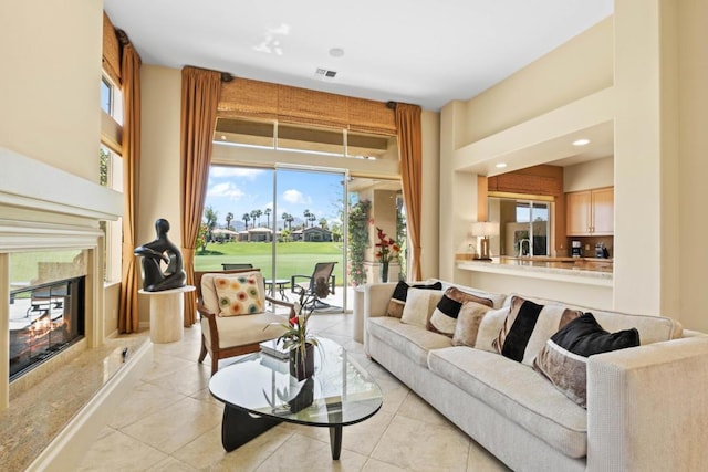 tiled living room featuring a fireplace