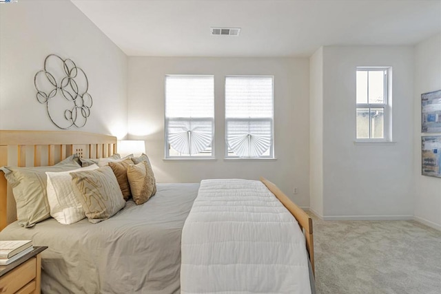 bedroom with light carpet