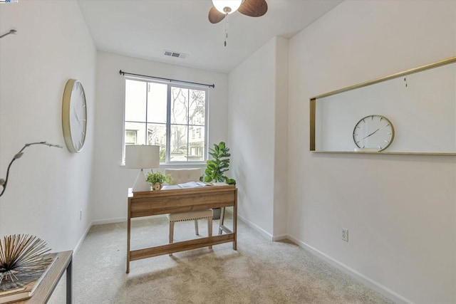 home office with light carpet and ceiling fan