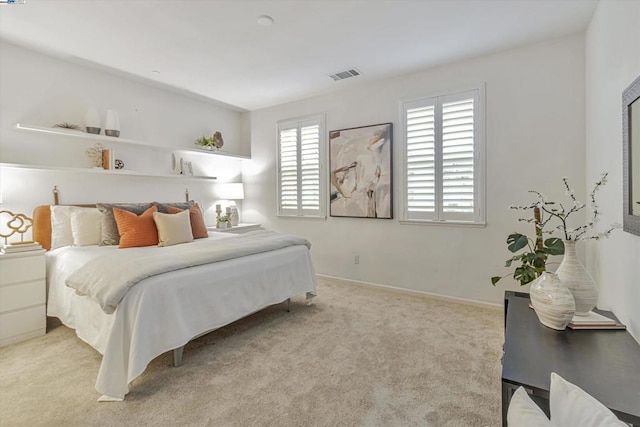 bedroom with light colored carpet