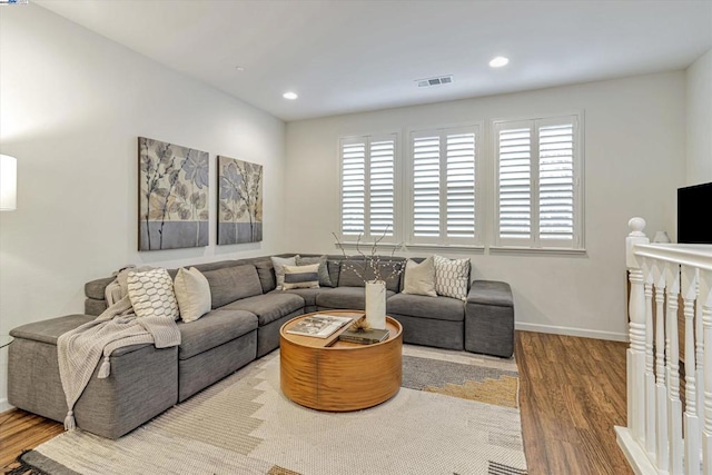 living room with light hardwood / wood-style flooring