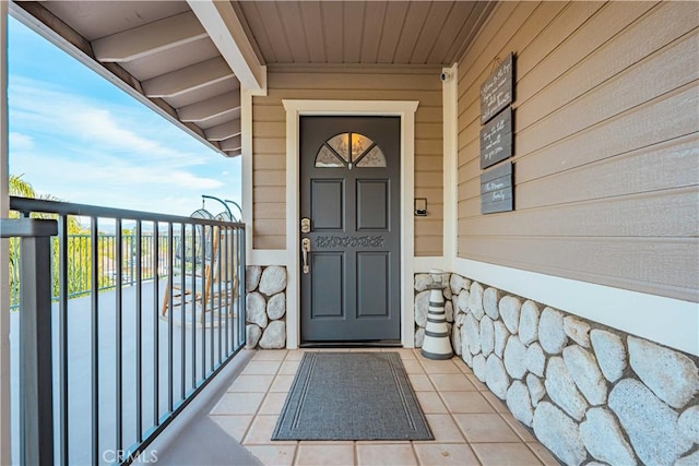 doorway to property featuring a balcony