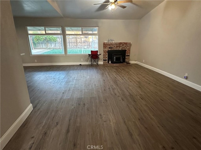 unfurnished living room with ceiling fan and dark hardwood / wood-style floors