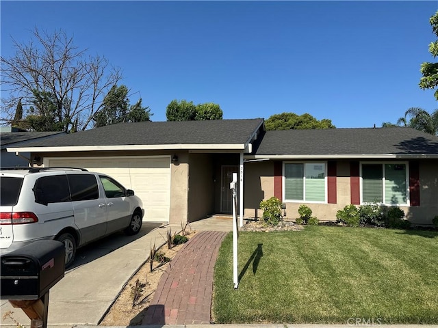 3514 Oakhurst Ave, Merced, CA 95340 - ranch-style home featuring a garage, stucco siding, a front yard, and roof with shingles