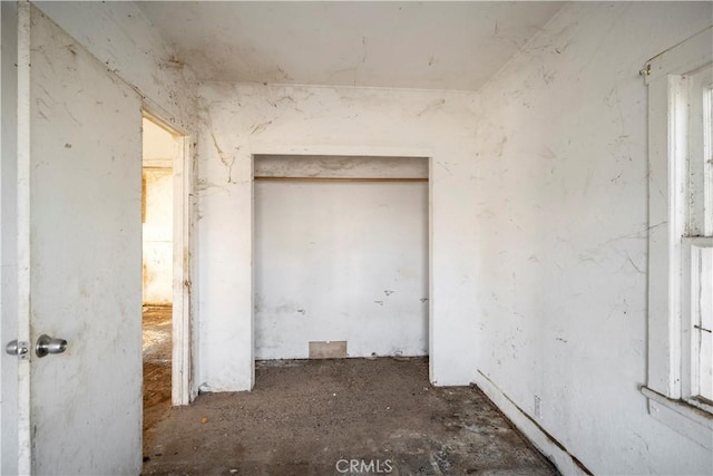 unfurnished bedroom featuring a closet