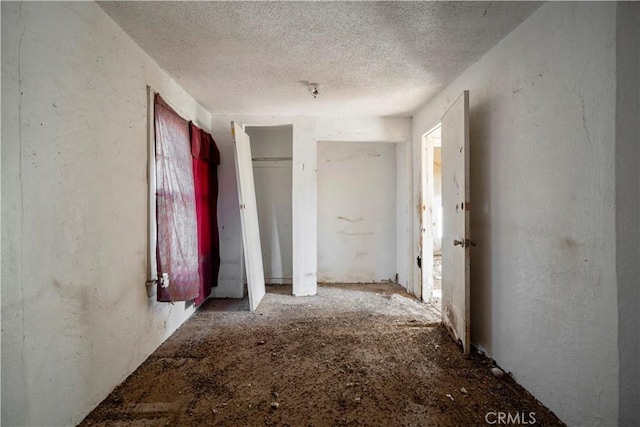 interior space with a textured ceiling