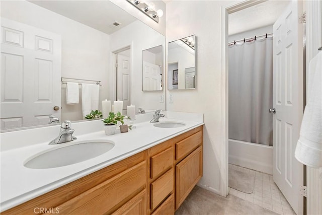 full bathroom featuring shower / tub combo, tile patterned flooring, a sink, and double vanity