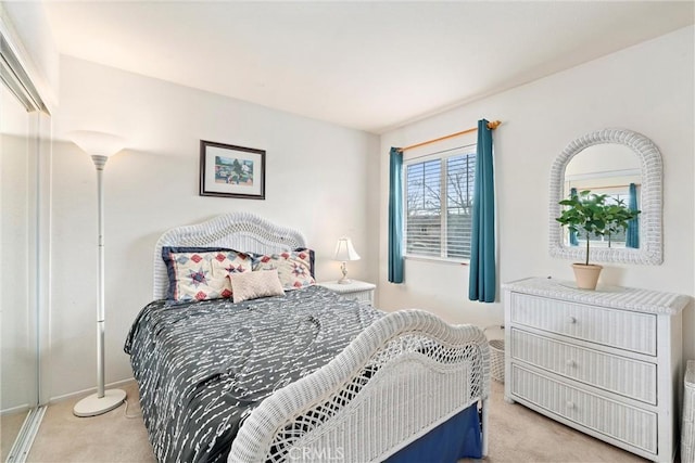 bedroom featuring light carpet