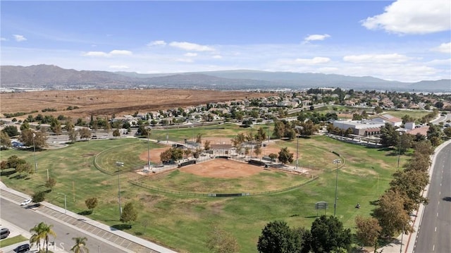 drone / aerial view featuring a residential view and a mountain view