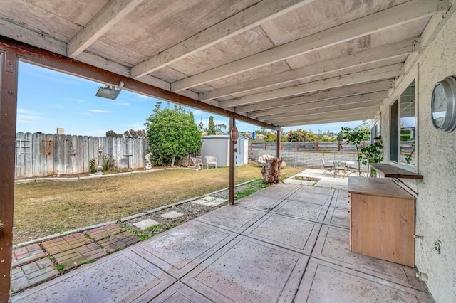 view of patio with a shed