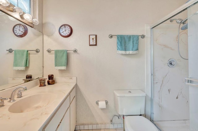 bathroom with an enclosed shower, vanity, and toilet