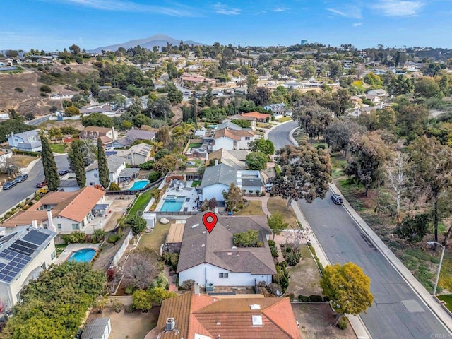 birds eye view of property featuring a mountain view