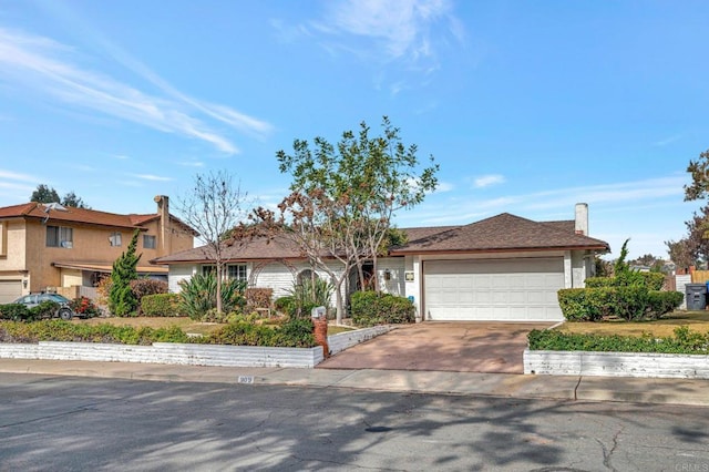 ranch-style house featuring a garage