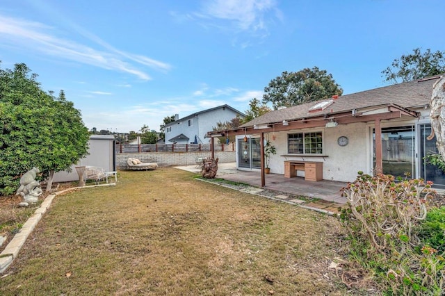 view of yard with a storage shed and a patio area