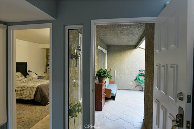 hall with light tile patterned flooring