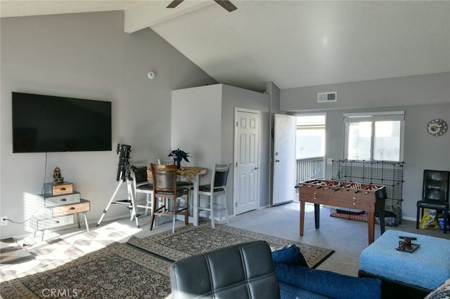 carpeted living room featuring ceiling fan, high vaulted ceiling, and beam ceiling