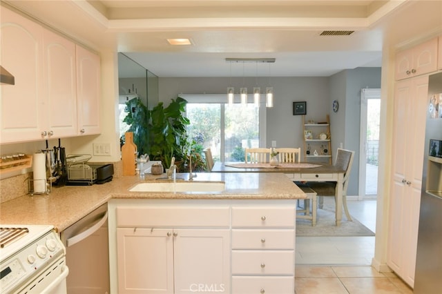 kitchen with pendant lighting, sink, white cabinetry, stainless steel appliances, and kitchen peninsula