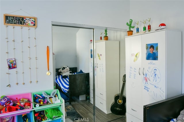 game room with wood-type flooring