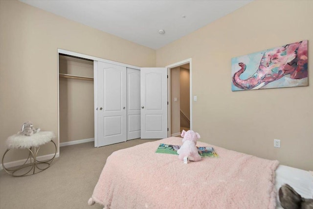 carpeted bedroom with a closet