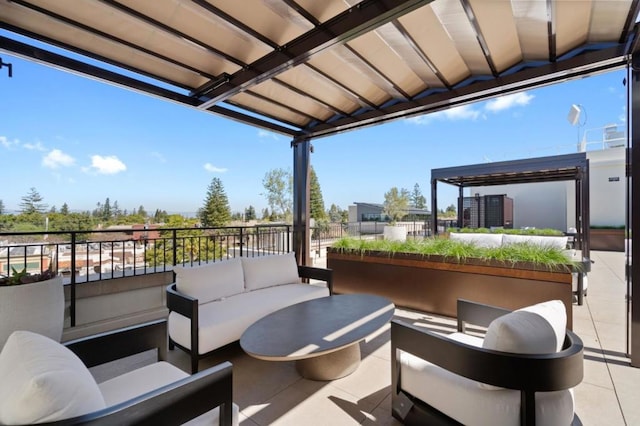 view of patio with outdoor lounge area and a balcony