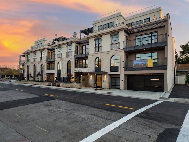 view of outdoor building at dusk