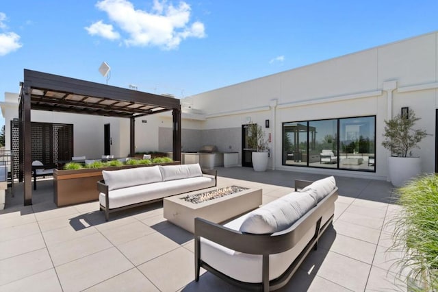 view of patio featuring a pergola and an outdoor living space with a fire pit