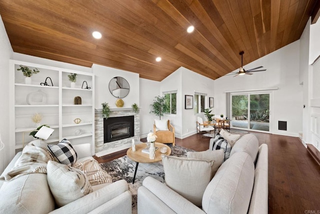 living room with vaulted ceiling, a stone fireplace, hardwood / wood-style floors, ceiling fan, and wooden ceiling