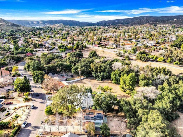 birds eye view of property with a mountain view