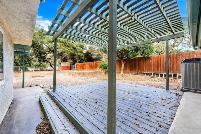 view of patio with a wooden deck, a pergola, and central AC unit