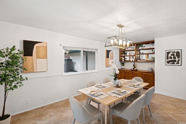 dining area featuring an inviting chandelier and light tile patterned floors