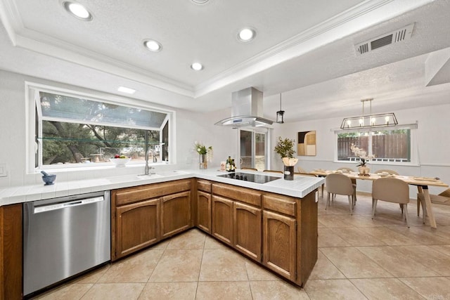 kitchen with a raised ceiling, dishwasher, island range hood, and kitchen peninsula