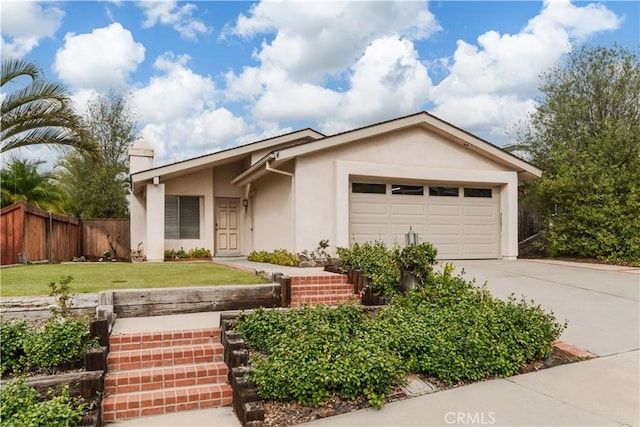 single story home with a garage and a front lawn