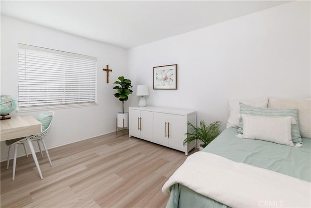 bedroom with light hardwood / wood-style flooring