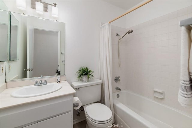 full bathroom with shower / bath combo, vanity, and toilet