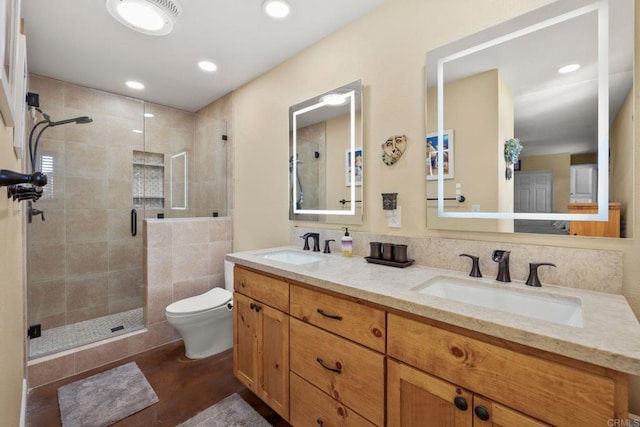 bathroom with vanity, toilet, and walk in shower