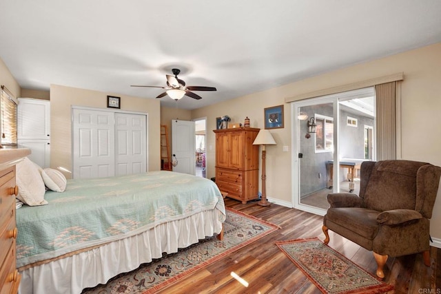 bedroom featuring wood-type flooring, a closet, ceiling fan, and access to outside