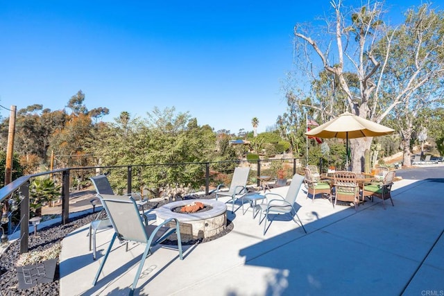 view of patio / terrace with a fire pit