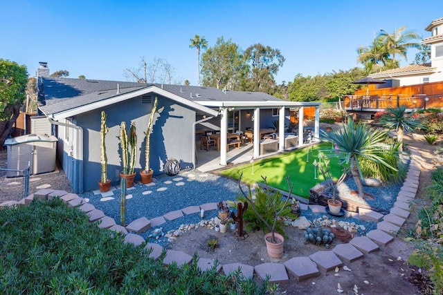 rear view of property with a patio area