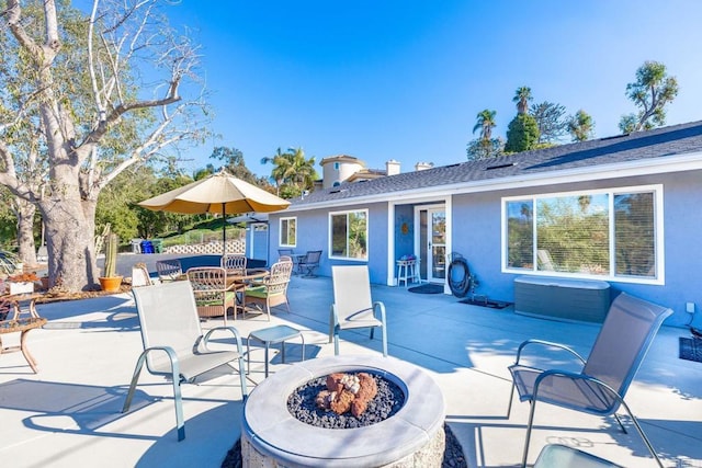 view of patio / terrace featuring an outdoor fire pit