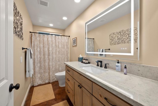 bathroom with vanity and toilet