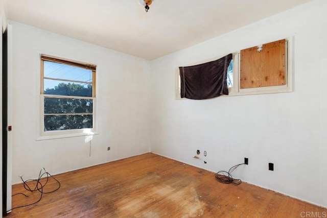 unfurnished room featuring wood-type flooring