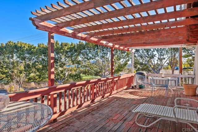 wooden deck featuring a pergola