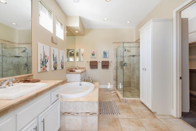 bathroom with vanity, independent shower and bath, and tile patterned flooring