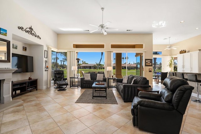 living room featuring ceiling fan and light tile patterned floors