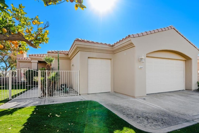 mediterranean / spanish-style house featuring a garage