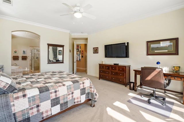 bedroom with light carpet, crown molding, ensuite bath, and ceiling fan